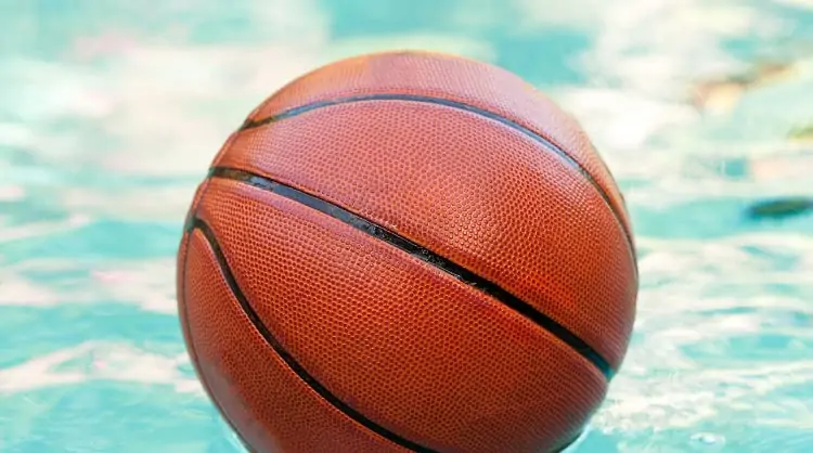 a basketball floating on the water